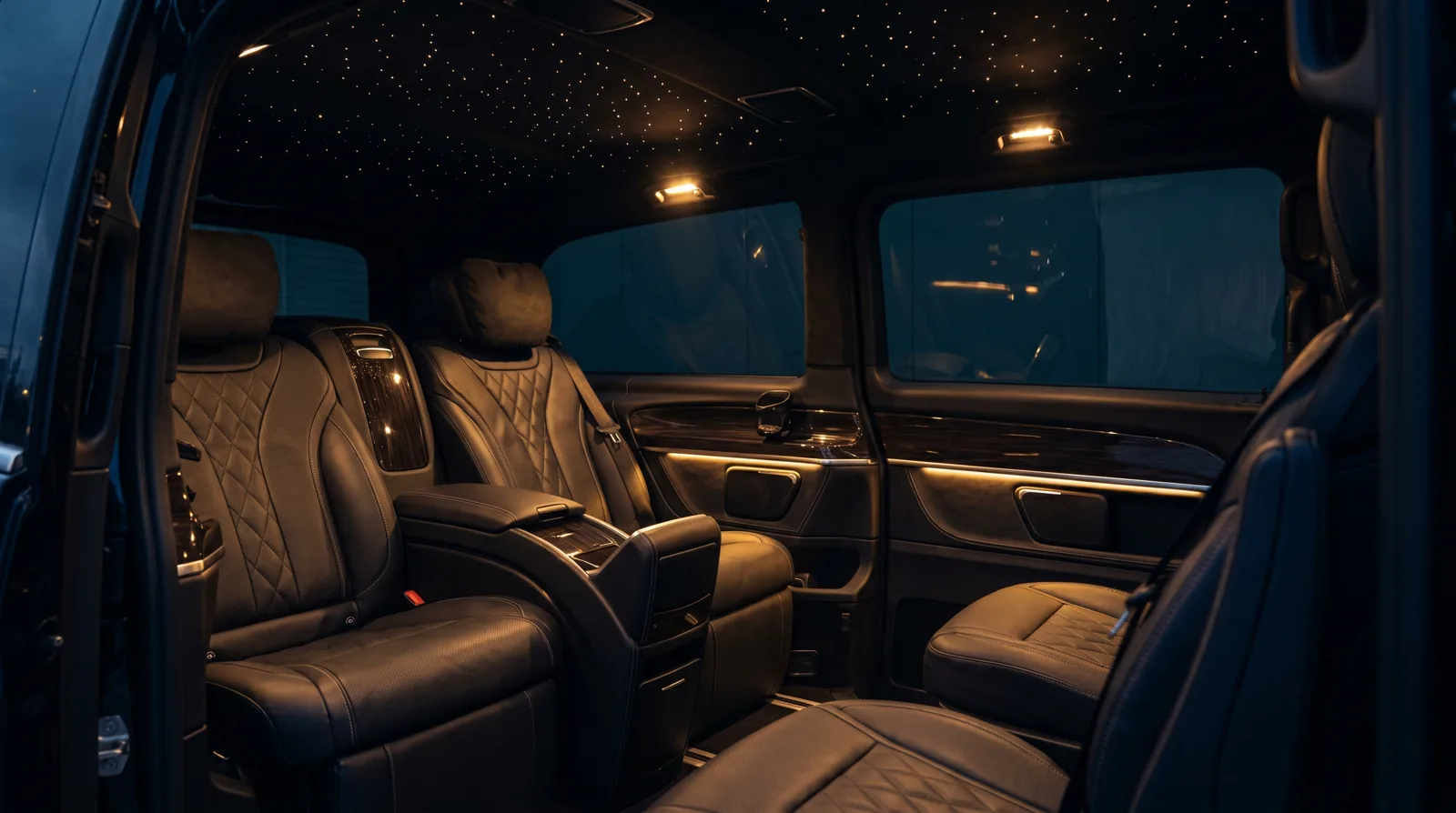 Executive Mercedes V-Class rear cabin with starlight headliner and warm ambient lighting
